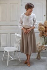 elegancka spódnica z wysokim stanem midi z wełny merino w kolorze beżowej jodełki lilen