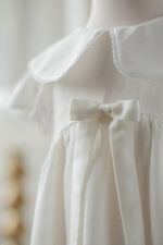 sukieneczka do chrztu z kokardą śmietankowa lilen polska marka